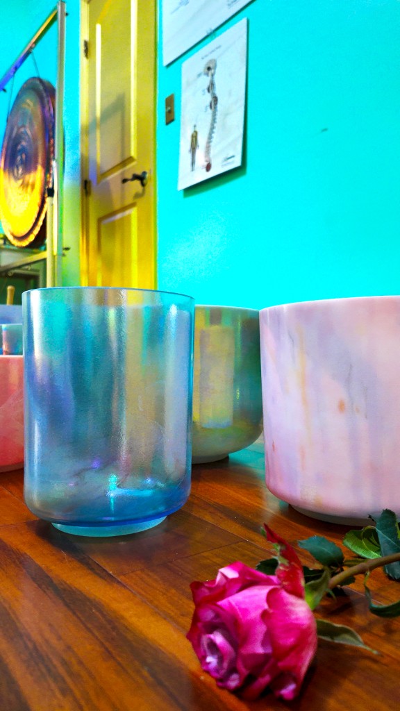 Crystal singing bowls with a rose